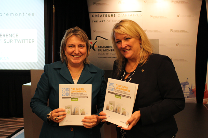 two women holding plan